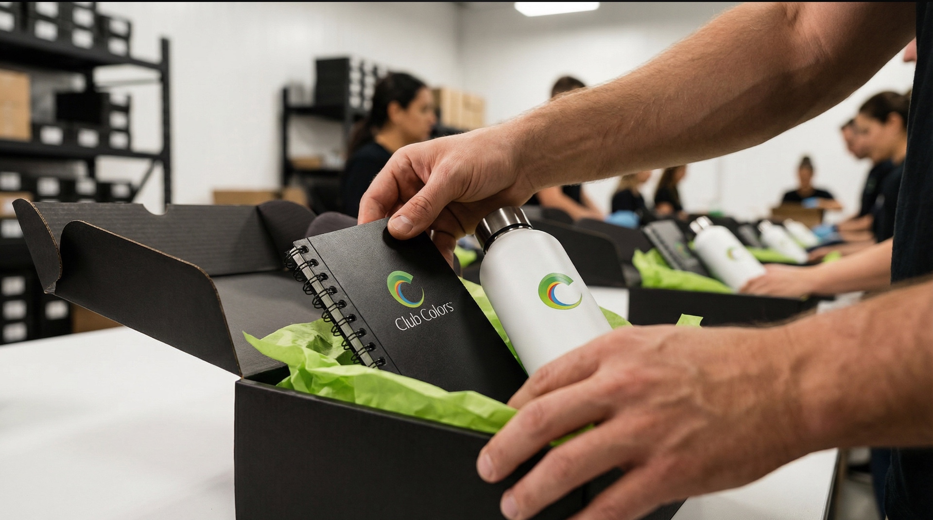 Branded kit being packed for fulfillment